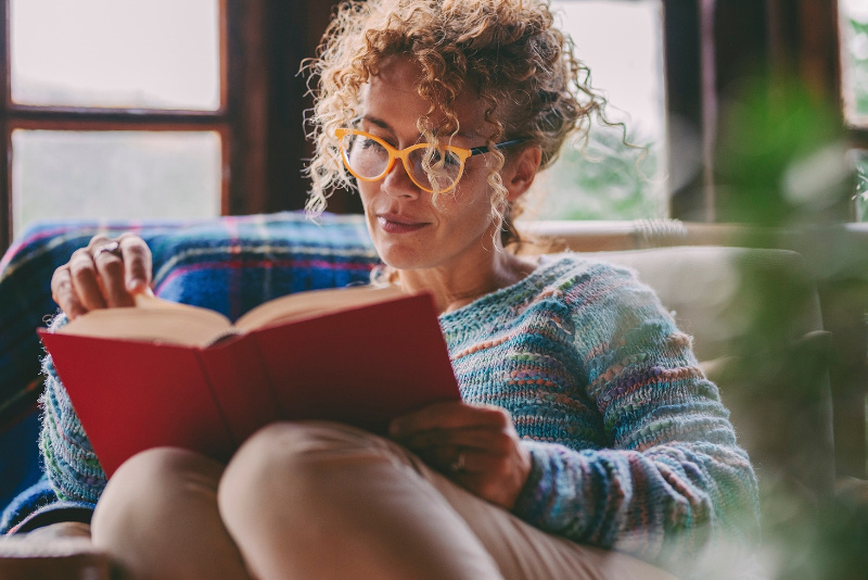 Woman At Home Sitting And Read